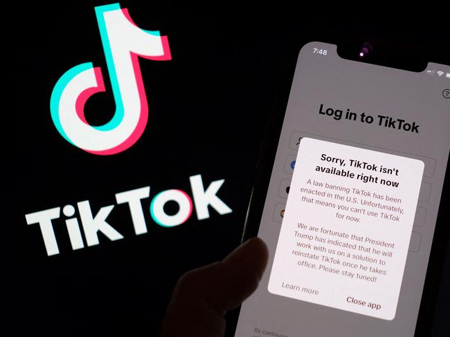 This illustration photo taken in Los Angeles on January 18, 2025, shows the TikTok app on a smartphone screen in front of the TikTok logo. TikTok disconnected access to its users in the United States late January 18 after no action was taken shortly before a national ban was to take effect, in the name of national security, unless its Chinese owners reach a deal to sell it to non-Chinese buyers by January 19, with President-elect Donald Trump unable to intervene until he takes office. "A law banning TikTok has been enacted in the US," said a message to users attempting to use the app. "Unfortunately, that means you can't use TikTok for now." (Photo by Chris DELMAS / AFP)