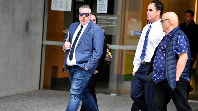 Senior Constable Jason Mole, left, and Senior Constable Dylan Johnston, centre in white shirt. Photo: John Gass