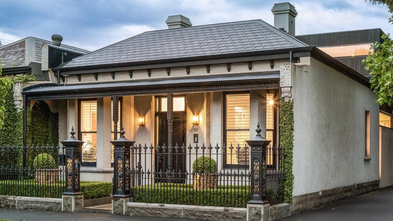 The Victorian-inspired double-fronted facade contrasts with the house’s modern-style rear.