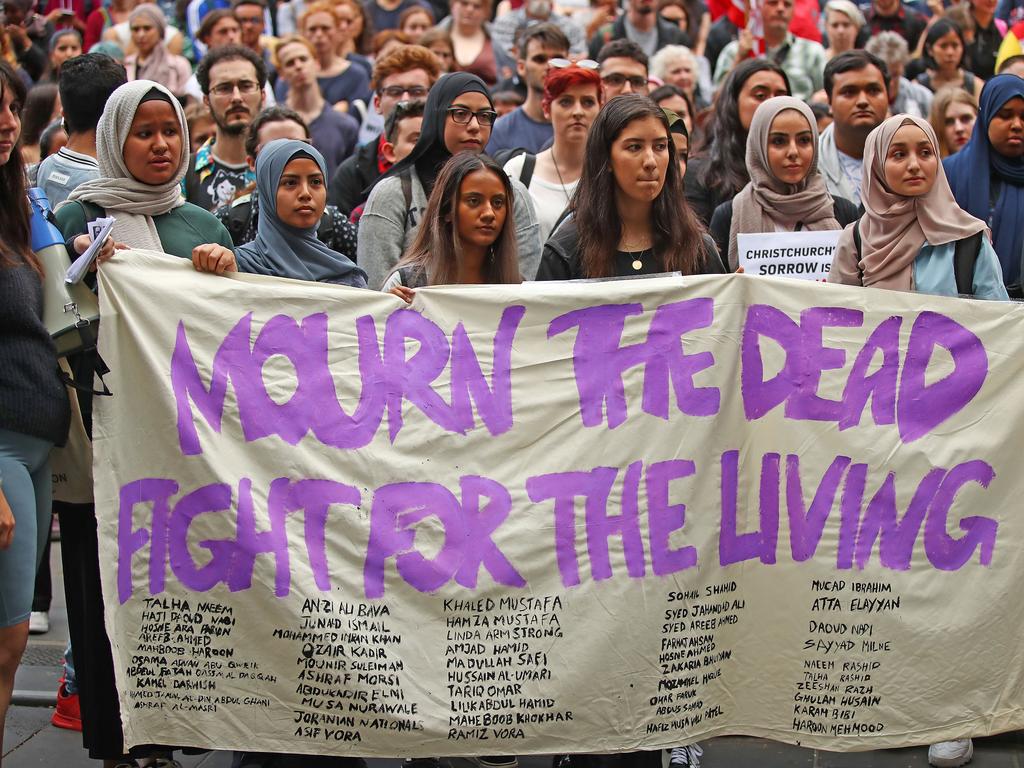 Protesters hold placards aloft as they march during the Stand Against Racism and Islamophobia: Fraser Anning Resign! rally on March 19, 2019 in Melbourne, Australia. Picture: Getty