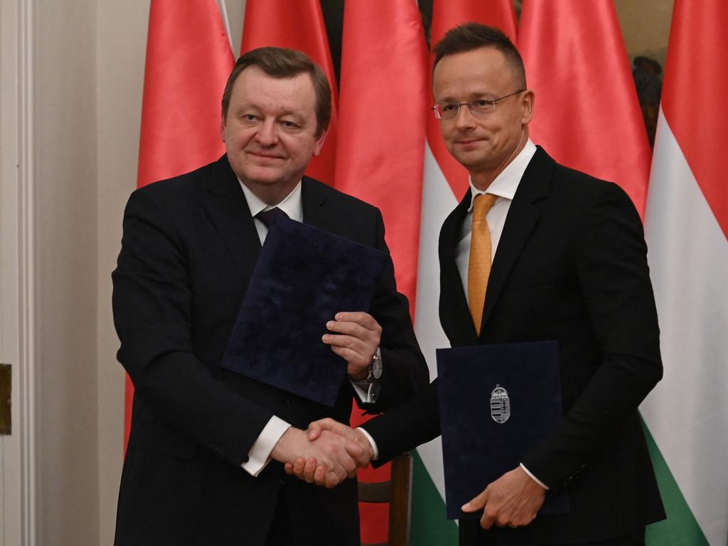 Hungarian Foreign and Trade Minister Peter Szijjarto (R) shakes hands with Belarusian Foreign Minister Sergei Aleinik. Belarus is a strong Russian ally, pledging support to Vladimir Putin.