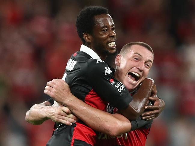SYDNEY, AUSTRALIA - APRIL 06: Bruce Kamau of the Wanderers celebrates with Mitch Duke of the Wanderers after scoring his second goal during the A-League match between Western Sydney Wanderers FC and the Central Coast Mariners at Bankwest Stadium, on April 06, 2021, in Sydney, Australia. (Photo by Mark Metcalfe/Getty Images)