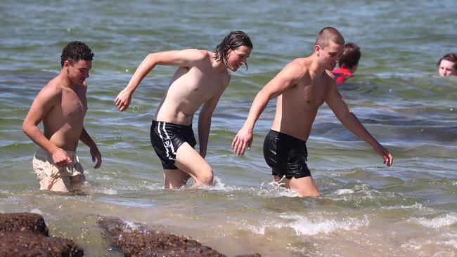 Schoolies go for a dip at Clarkes Beach in Byron Bay. Photograph: Jason O'Brien