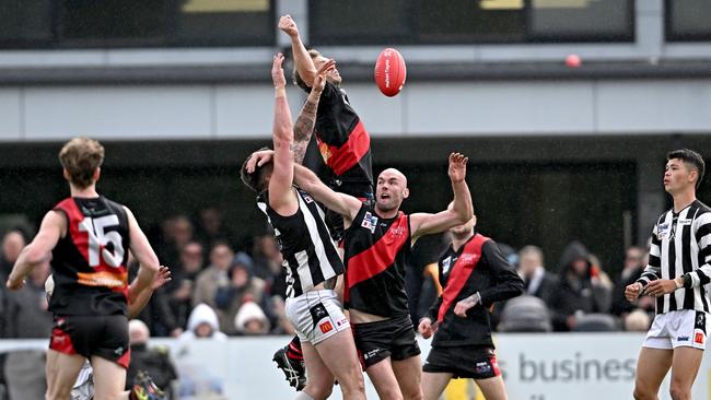 Riddell and Wallan players fly for the ball. Picture: Andy Brownbill