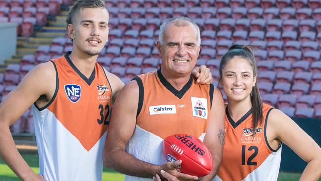 Russell Jeffrey, centre, with son Joel, left and daughter Lateesha have all experienced the pride and passion of representative football for the NT. Picture: GLENN CAMPBELL