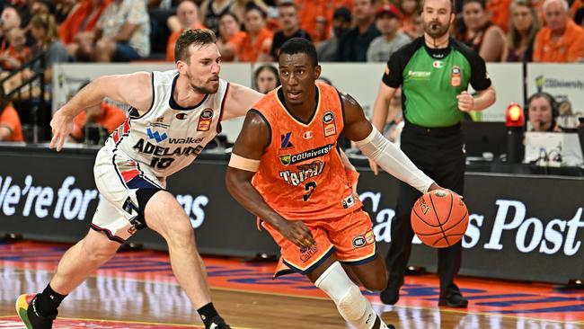 Shannon Scott of the Taipans drives up court.