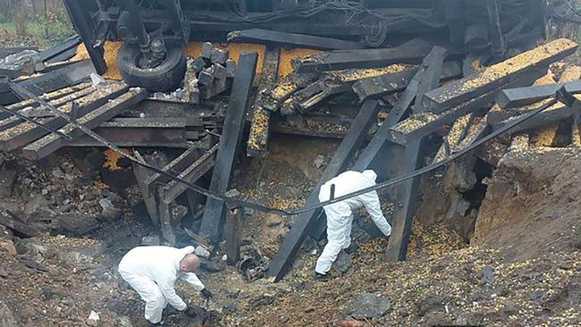 Forensic experts investigate the site where a missile hit the southeastern Polish village of Przewodow. Picture: Polish Police via AFP