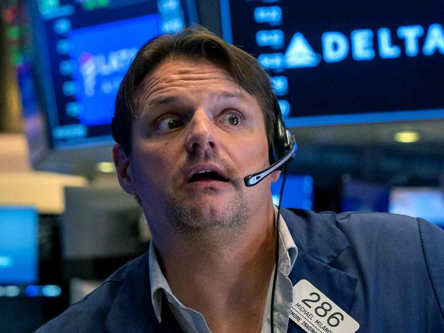 NEW YORK, NEW YORK - OCTOBER 22: Traders work on the floor of the New York Stock Exchange (NYSE) on October 22, 2024 in New York City. The Dow was down over 100 points in morning trading following a drop of over 300 on Monday.   Spencer Platt/Getty Images/AFP (Photo by SPENCER PLATT / GETTY IMAGES NORTH AMERICA / Getty Images via AFP)