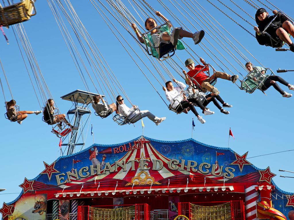 Show goers ride the Wave Swinger. Picture: Toby Zerna