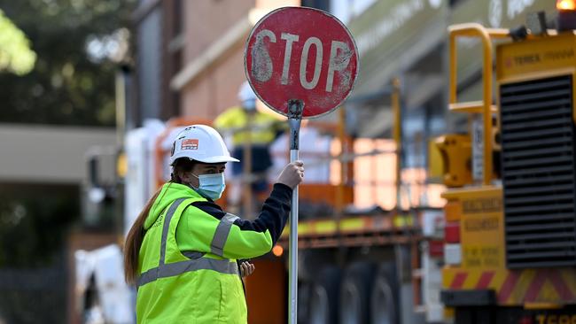 Construction workers wear face mask onsite in North Sydney on Saturday. Construction will resume in certain parts of Greater Sydney this week. Picture: NCA NewsWire/Bianca De Marchi