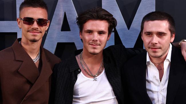 Romeo Beckham (L), Cruz Beckham (C) and thier borther Brooklyn Beckham poses on the red carpet upon arrival to attend the Premiere of 