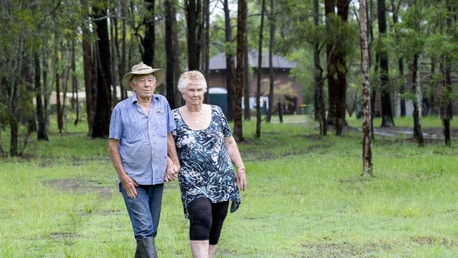 Keith Connors and Veronica Russo-Connors in their front yard, where Logan City Council wants to put in a sewerage pipe. PHOTO: AAP/Renae Droop