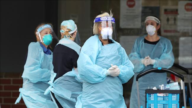 A Covid testing team arrive at Arcare aged care in Maidstone. Picture: David Crosling