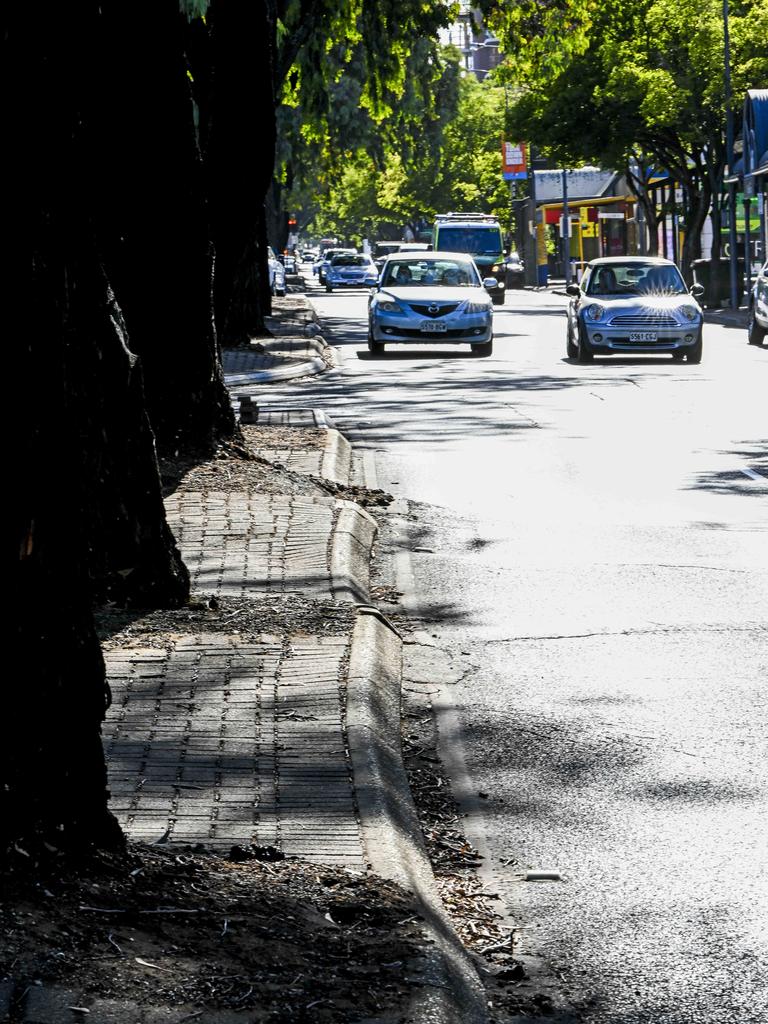 Traffic on the Parade Norwood navigating the buckled road. Picture Mark Brake