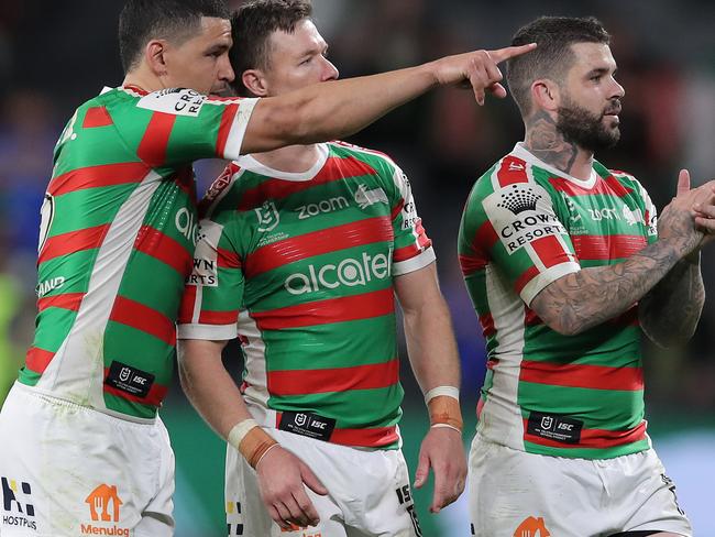 SYDNEY, AUSTRALIA - OCTOBER 10: Adam Reynolds, Cody Walker and Damien Cook of the Rabbitohs wave to fans after the Rabbitohs defeated the Eels during the NRL Semi Final match between the Parramatta Eels and the South Sydney Rabbitohs at Bankwest Stadium on October 10, 2020 in Sydney, Australia. (Photo by Matt King/Getty Images)