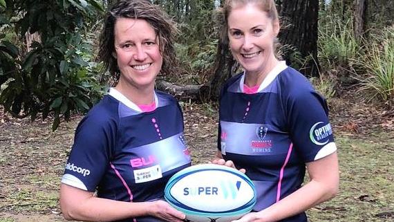 CFA people and culture executive director Liz Radcliffe (left) with CFA deputy chief officer Steph Rotarangi in rugby gear.