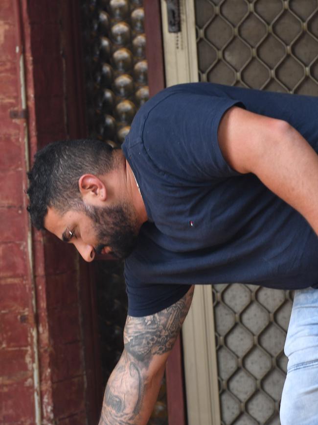 A man emerges from the home listed on the accused woman’s bail application. Picture: Keryn Stevens