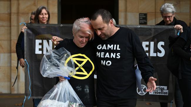 Extinction Rebellion protesters Sarah Edwards and Bradley Homewood outside Adelaide Magistrates Court. Picture: NCA NewsWire/ Naomi Jellicoe.