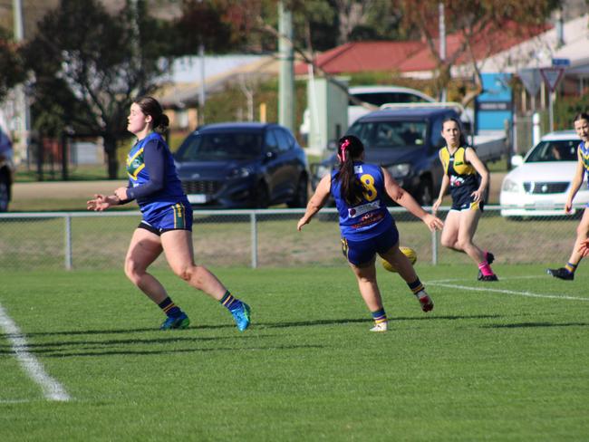 SFLW Community League - St Virgils' Dakota Scott gets a kick away in the match against Sorell during the annual Pink Sock-Carolyn Birch Memorial Match. Picture: Jake Garland