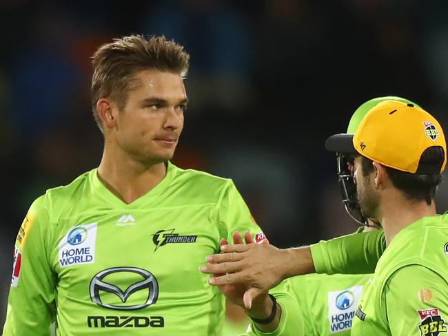 CANBERRA, AUSTRALIA - DECEMBER 29: Chris Green of the Thunder celebrates with Callum Ferguson of the Thunder after dismissing Ben Dunk of the Stars during the Big Bash League match between Sydney Thunder and the Melbourne Stars at Manuka Oval, on December 29, 2020, in Canberra, Australia. (Photo by Mike Owen/Getty Images)