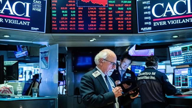 Traders work on the floor of the NYSE as it fell into a bear market overnight. Picture: Jeenah Moon/Getty Images/AFP.