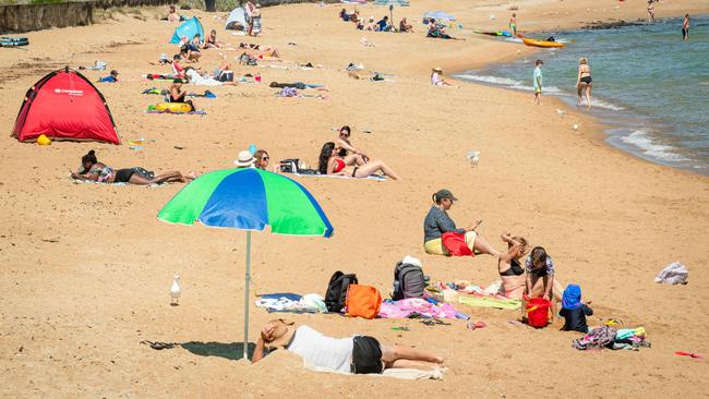 Melbourne’s five-day lockdown did not stop some from lapping up the sun at Parkdale beach. Picture: Jason Edwards