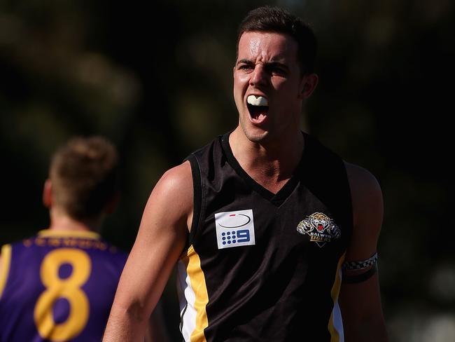 Luke Barker celebrates a goal during the 2012 grand final. Picture: Hamish Blair