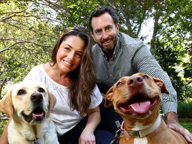 Michael and Kim McTeigue pictured with their rescue dogs Max (L) and Missy. Through their business SavourLife dog food they have donated over $1million during the past 6 years to help rescued dogs find a new home. Picture: Toby Zerna