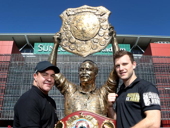 Jeff Fenech (left) and Jeff Horn at the Wally Lewis statue outside Suncorp Stadium in Brisbane. Picture: Darren England.