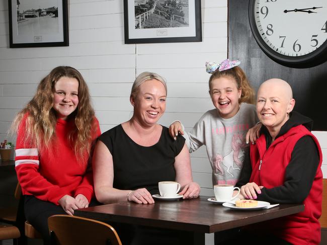 Jenny Barbary from Quartz Cafe on Main South Road in Morphett Vale, S.A. is aiming to raise $6000 for Kristy - who has cancer - and her Daughters, Imogen (red) and Tahlia. (AAP/Emma Brasier)