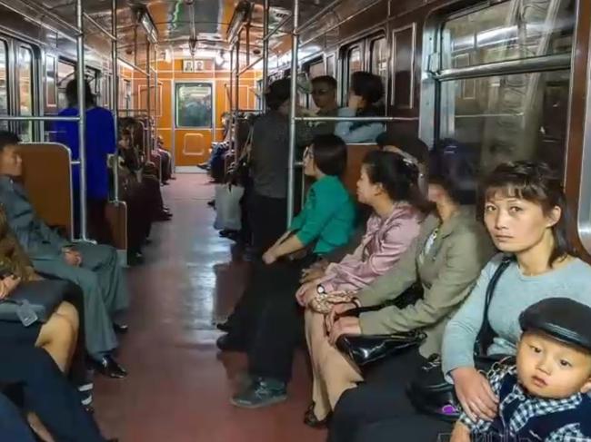 North Koreans are seen riding the train in Pyongyang. Picture: Rob Whitworth and JT Singh/National Geographic