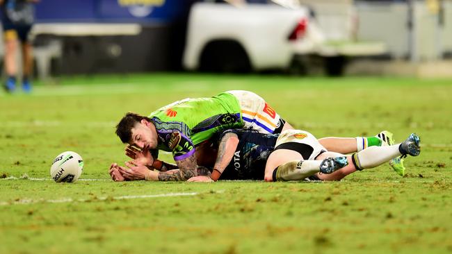 Cowboy Ben Hampton is crushed by Canberra’s Curtis Scott. Picture: Alix Sweeney