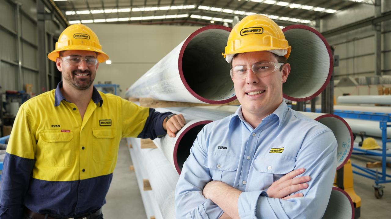 Showcasing the length of Wagners' new power poles, made from the company's composite-fibre technology, are CFT Australia and New Zealand general manager Ryan Leeson and president of North American operations Denis Wagner Jr.