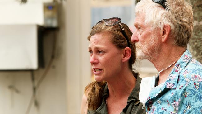 Pat Guest comforts his daughter, Alice, after they lost the family home in the fires near Bobin. Picture: Peter Lorimer.