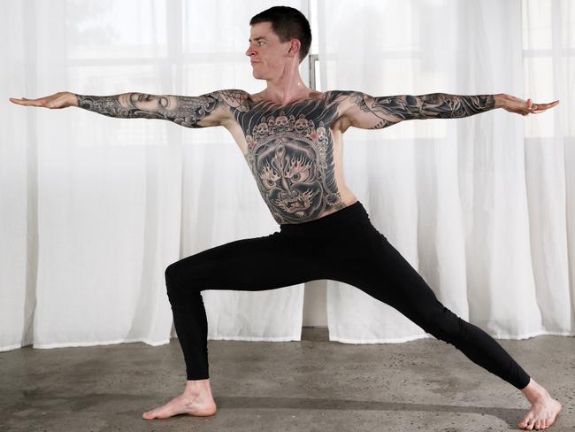 Nick Hall goes through one of his routines at One Hot Yoga in South Yarra. Picture: Michael Klein