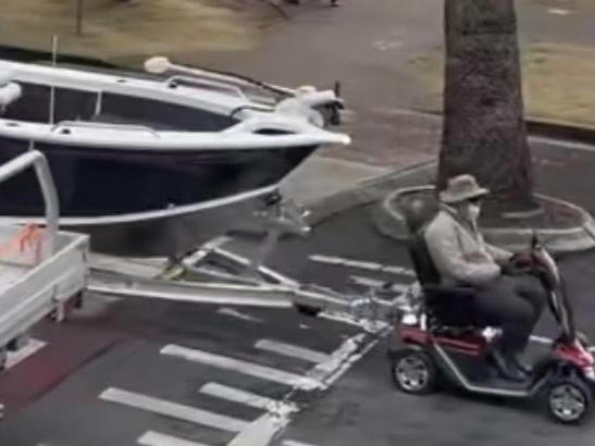 A TikTok video has gone viral as a man was filmed pulling a boat with his mobility scooter. Pictures: TikTok/ @tashontiktokxoxo