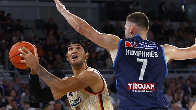 MELBOURNE, AUSTRALIA – OCTOBER 20: Keanu Pinder of the Taipans drives to the basket under pressure from Isaac Humphries of United during the round four NBL match between Melbourne United and Cairns Taipans at John Cain Arena, on October 20, 2022, in Melbourne, Australia. (Photo by Daniel Pockett/Getty Images)