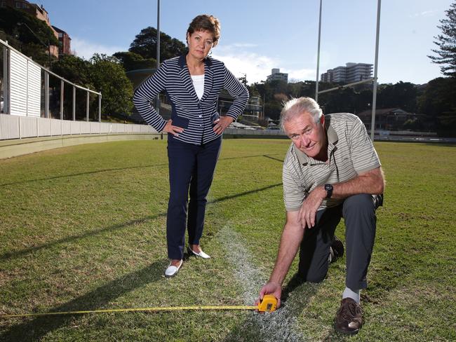 Jack Steggall and Candy Bingham are against plans to put a car park under Manly Oval. Picture: Adam Ward.