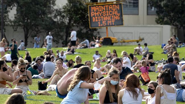 Beachgoers are being urged to follow the rules and avoid scenes like those at St Kilda foreshore in October. Picture: David Geraghty