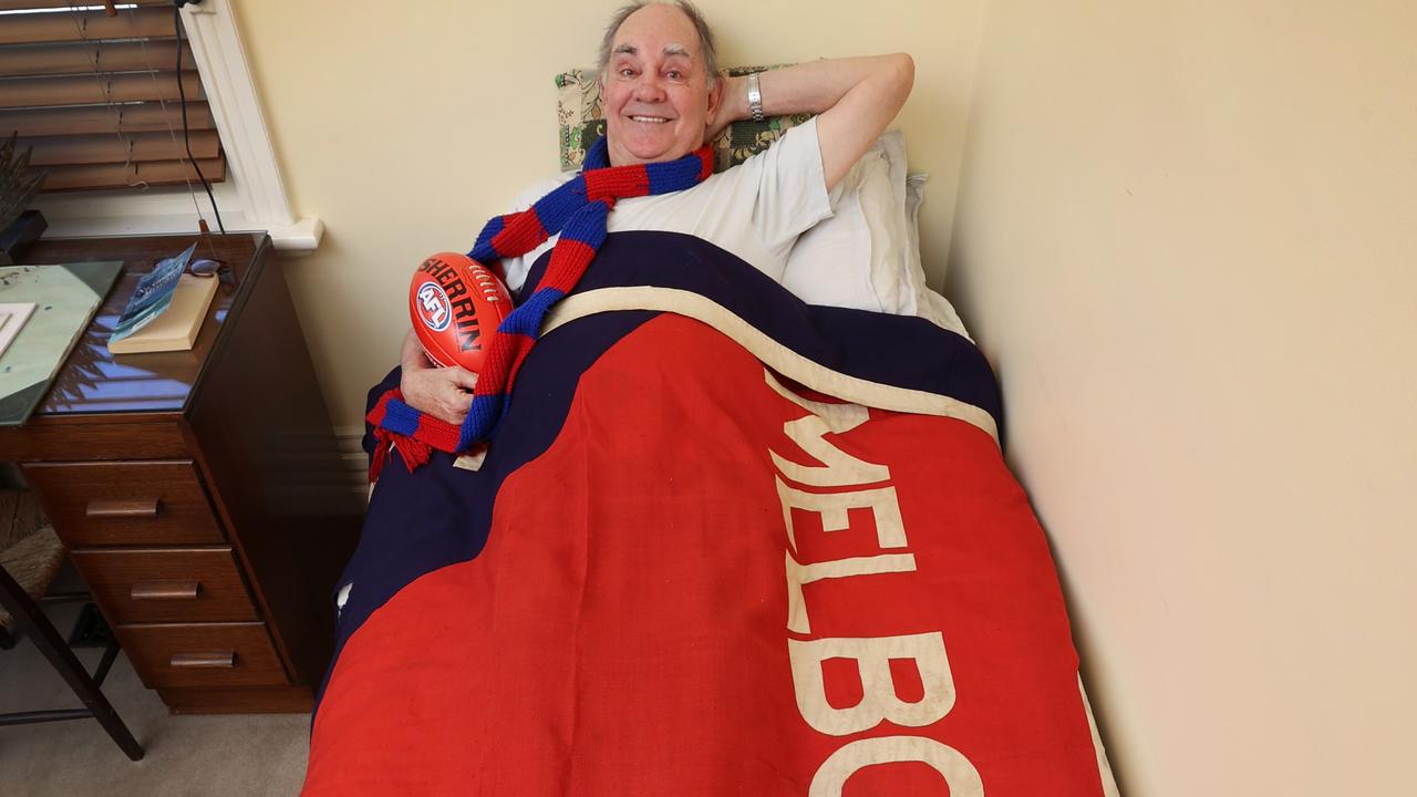 John Burns with the stolen flag, which was used as a bedspread for years. Picture: David Caird