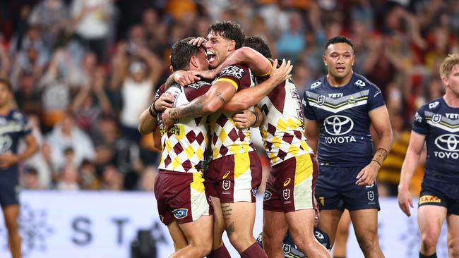 BRISBANE, AUSTRALIA - MARCH 29: Tyson Smoothy of the Broncos celebrates a try during the round four NRL match between Brisbane Broncos and North Queensland Cowboys at Suncorp Stadium, on March 29, 2024, in Brisbane, Australia. (Photo by Chris Hyde/Getty Images)