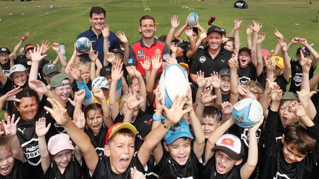 Little Rebel rookies meet Beau Fermor (titans) James Tsitas (Suns) and Matt Orford (Manly and Storm),at the Rebel school holiday training clinic at Pizzey Park . Picture Glenn Hampson