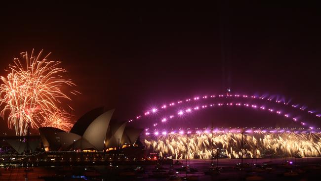 The harbour bridge lights up for the 9pm fireworks.