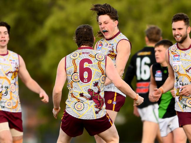 Dareo Rogers of Murrumbeena is congratulated by team mates after kicking a goal during the Southern Football Netball League 2023 Division 2 Senior match between Murrumbeena and Doveton Doves at Murrumbeena Park in Murrumbeena, Victoria on July 8, 2023. (Photo by Josh Chadwick)