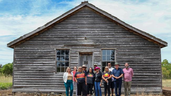 Donna, Tina and Joanne Wright stand with Yoorrook commissioners outside the Lake Condah Mission home where the sisters’ mother grew up. Picture: Brianna Young/Yoorrook Justice Commission