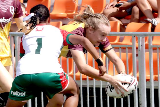 Country player No.4 Emily Jackwitz dives for a try, with City player No.1 Janique attempting a tackle, playing in the girlsÃ• City v Country representative league, match open the match-day program, Stones Corner- on April 16th 2025 - Photo Steve Pohlner