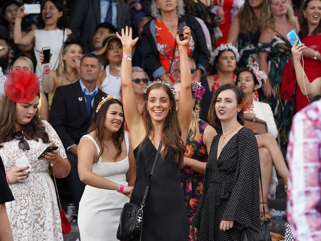 Racegoers are seen in the late afternoon on Melbourne Cup day during the Lexus Melbourne Cup Day, as part of the Melbourne Cup Carnival, at Flemington Racecourse in Melbourne, Tuesday, November 6, 2018. (AAP Image/Stefan Postles) NO ARCHIVING, EDITORIAL USE ONLY