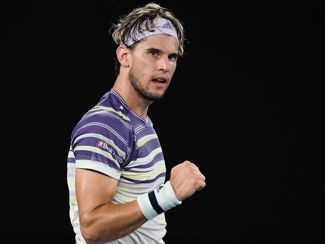 Austria's Dominic Thiem reacts after a point against Germany's Alexander Zverev during their men's singles semi-final match on day twelve of the Australian Open tennis tournament in Melbourne on January 31, 2020. (Photo by Saeed KHAN / AFP) / IMAGE RESTRICTED TO EDITORIAL USE - STRICTLY NO COMMERCIAL USE