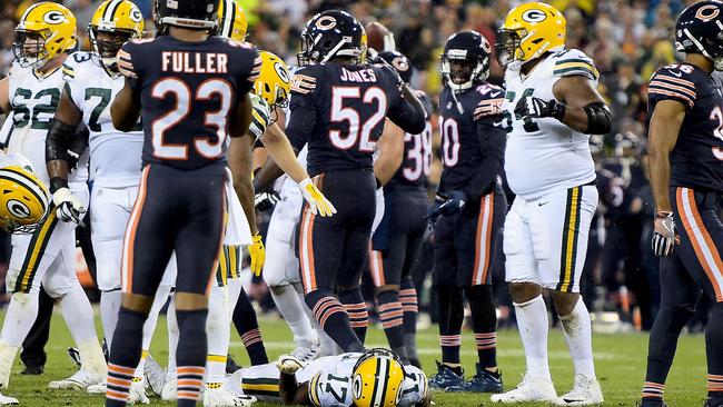 Davante Adams of the Green Bay Packers lays on the field after being injured.