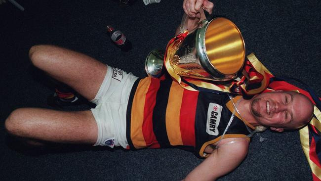 Celebrating the back-to-back triumph with the premiership cup.